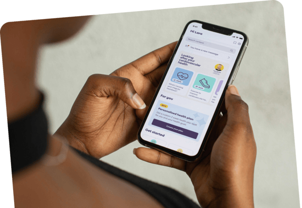 Person holding a phone showing the Peppy app welcome screen Person holding a phone showing the Peppy app welcome screen