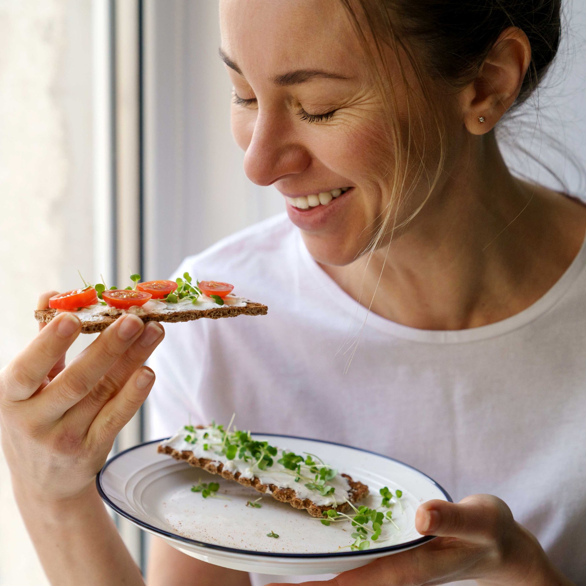 Close up of a woman eating a healthy snack